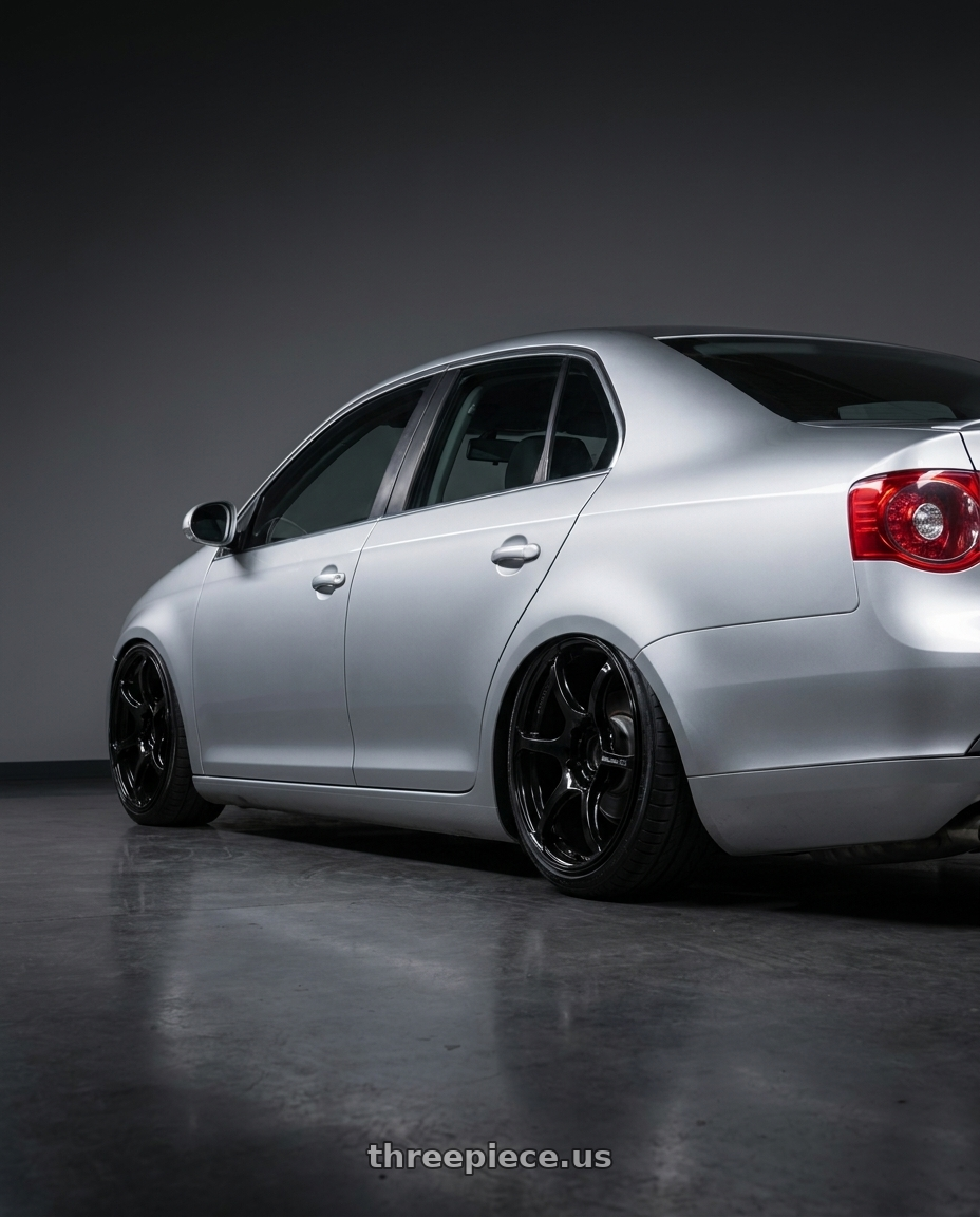 2009 Volkswagen Jetta GLI MK5 with Advan RGIII 5x112 18x8+50 Gloss Black wheels rear three quarter view slight stretch tires