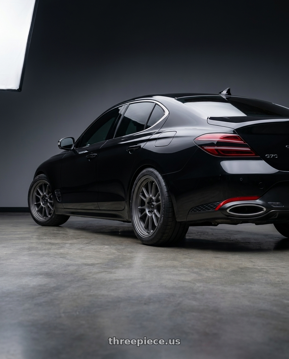 2023 Genesis G70 Victoria Black with Konig Hypergram 5X114.3 19x10.5+25 Matte Grey Flow Formed wheels rear three quarter view meaty tires