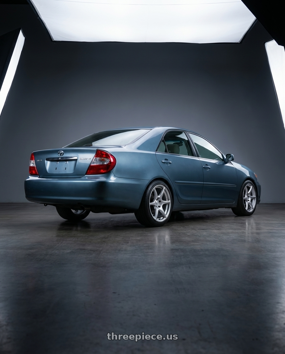 2002 Toyota Camry with Kansei K11S Tandem 5x114.3 17x9 35 Hyper Silver wheels rear three quarter view slight stretch tires