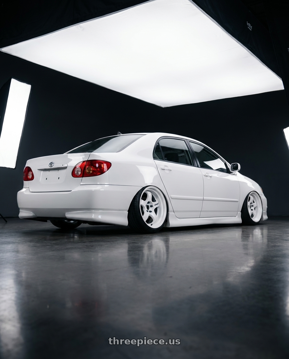 2006 corolla 9gen with Work Meister S1 2P 4x100 15x7+22 A Disk Black wheels rear three quarter view slight stretch tires