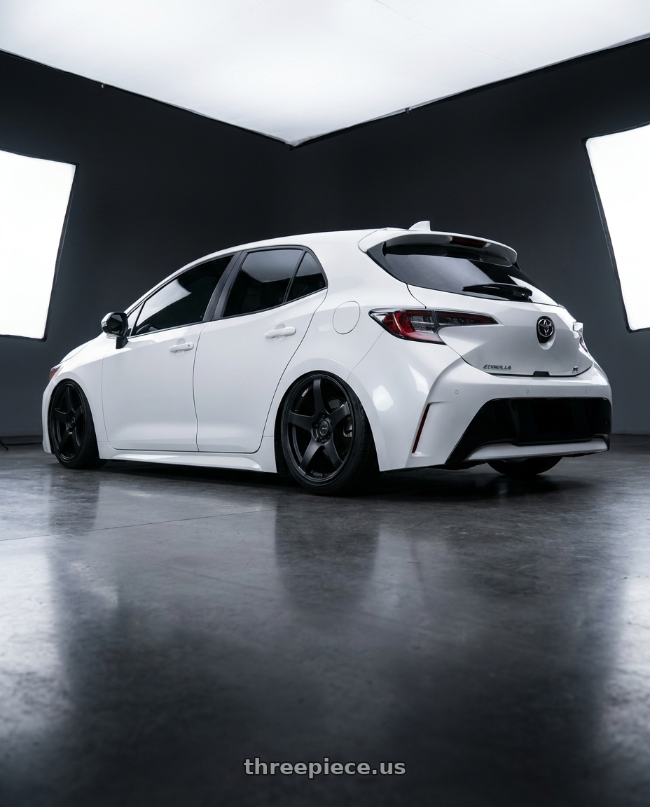 2023 Toyota Corolla Hatchback with Ssr Gtv01 5x114.3 18x8+35  FLAT BLACK wheels rear three quarter view slight stretch tires