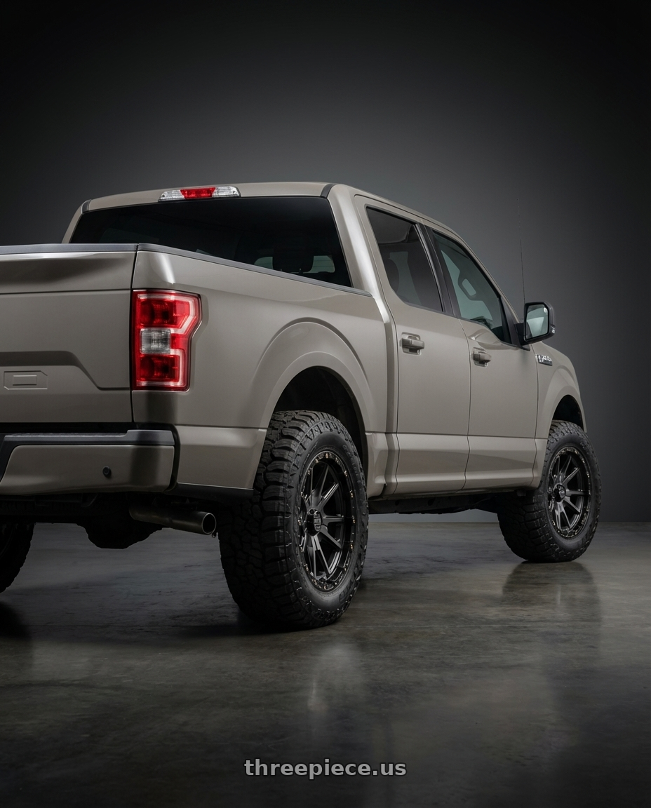 2019 Ford F-150 with KMC KM100 SYNC 6X135/6X139.7 20X9 +0 SATIN BLACK WITH GRAY TINT wheels rear three quarter view meaty tires