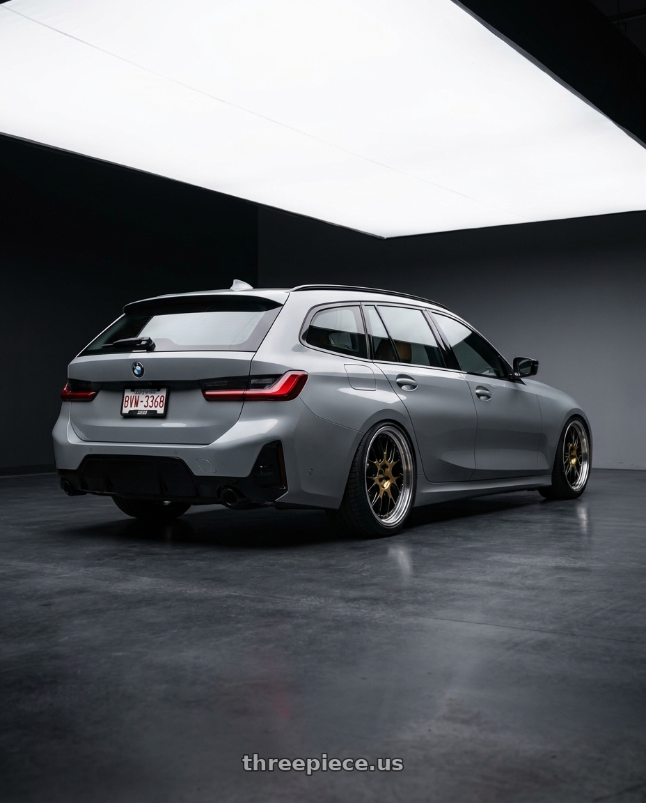 2024 BMW G21 320i, Brooklyn grey, leather nappa/zimt, license plate number BVW-3368 with BBS LM-R 5x120 20x9.5 +23 Gloss Black/Gold Center / Diamond Cut Lip wheels rear three quarter view slight stretch tires