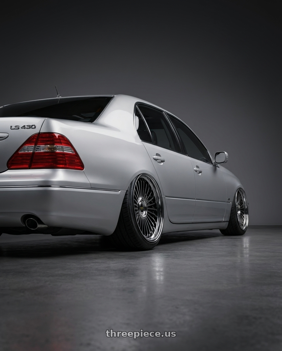 2004 lexus ls430 with Work Emitz Black Polish 5x114.3 19x9.0 +38 wheels rear three quarter view extreme stretch tires