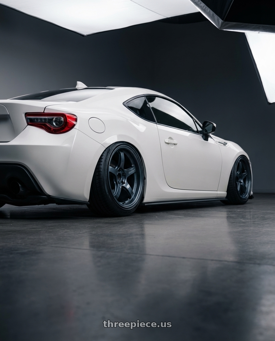 2016 Scion FR-S with Gram Lights 57CR 5x100 18x8.5+45 Gunblue II wheels rear three quarter view slight stretch tires
