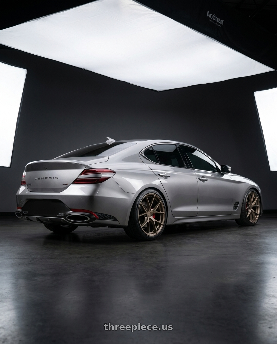 2026 Genesis g70 with Aodhan AFF7 5x112 19x8.5+35 Matte Bronze wheels rear three quarter view slight stretch tires