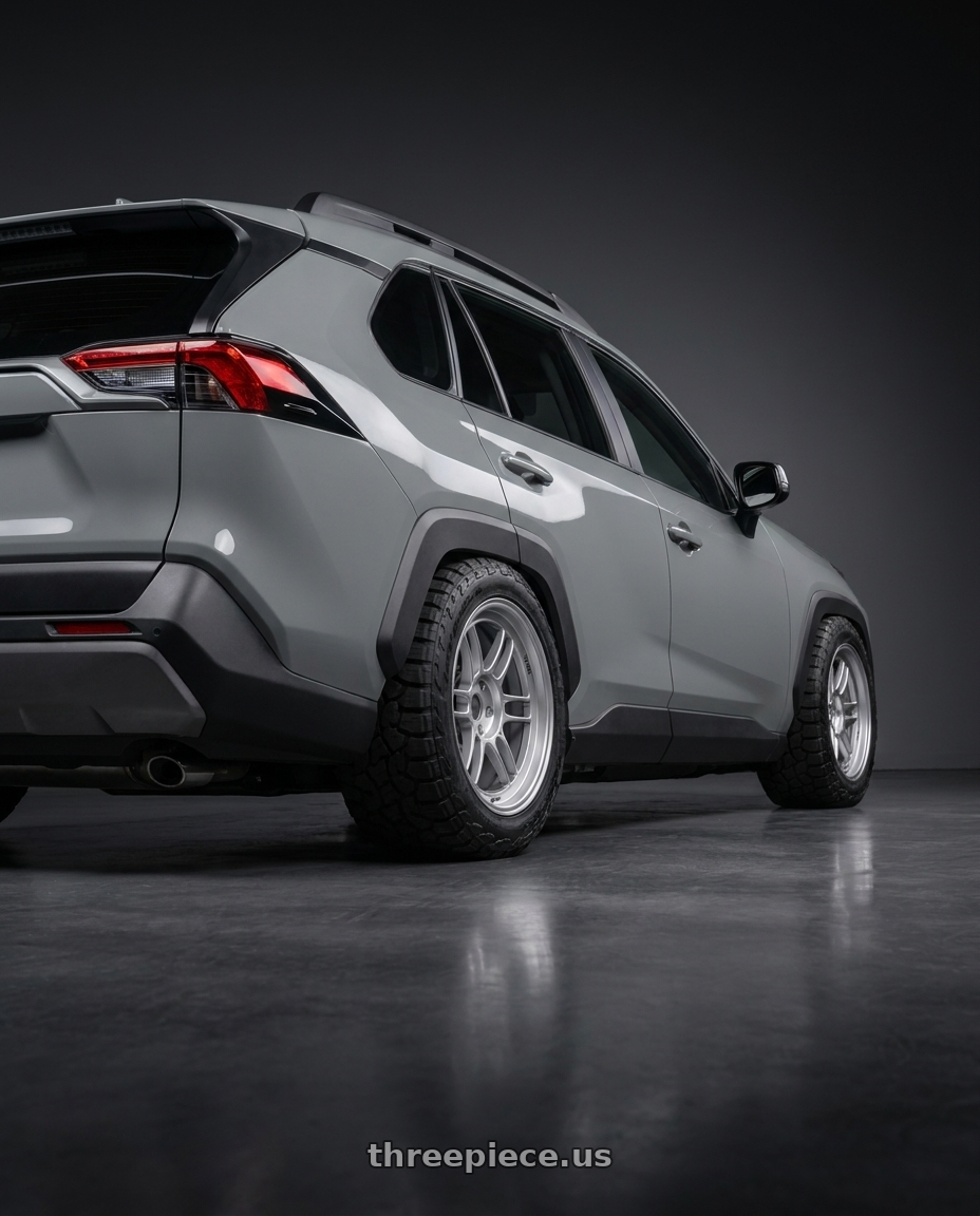 2026 Toyota RAV4  with Enkei RPF1 5x114.3 18x8.5+40 Silver wheels rear three quarter view meaty tires