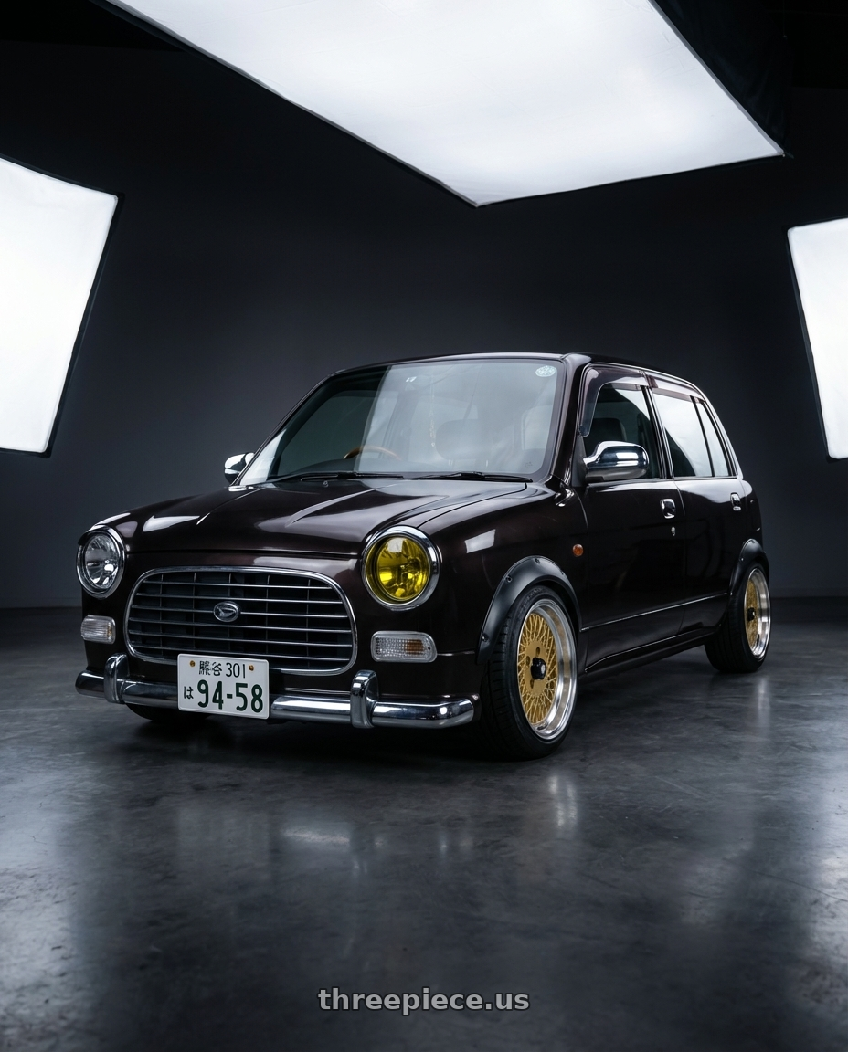 2000 Daihatsu Mira Gino  with Enkei Enkei92 Classic Line 4x100 15x7+38 Gold wheels