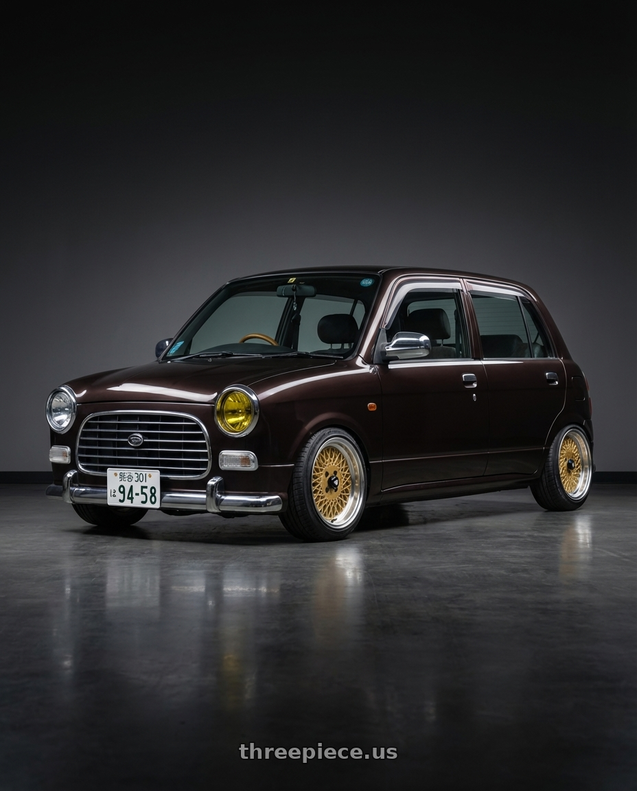 2000 Daihatsu Mira Gino  with Enkei Enkei92 Classic Line 4x100 15x7+38 Gold wheels rear three quarter view slight stretch tires