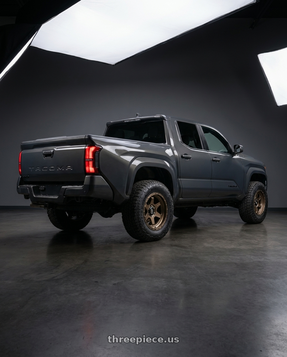 toyota tacoma 4th gen 2024 sr rwd with Fuel 1PC D666 SHOK 6X139.7 17X9 +1 MATTE BRONZE wheels rear three quarter view meaty tires