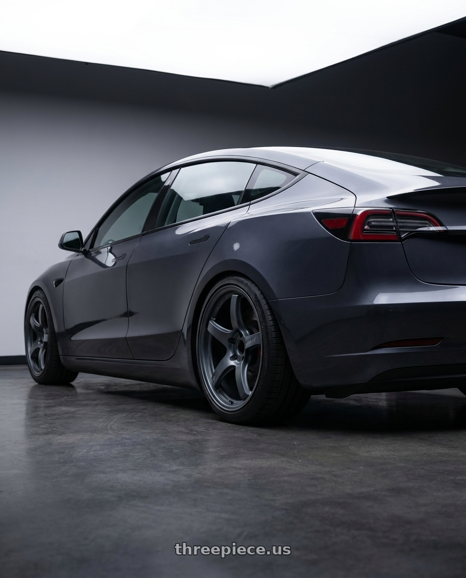 2023 Tesla Model 3 Performance with Gram Lights 57CR 5x114.3 19x9.5+25 Gunblue II wheels rear three quarter view square tires