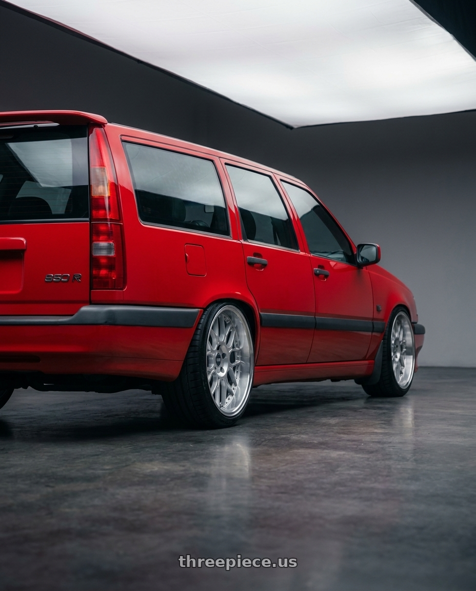 1994 Volvo 850 turbo wagon with ESR Wheels CS18 5x112 18x8.5 +40 Hyper Silver wheels rear three quarter view slight stretch tires