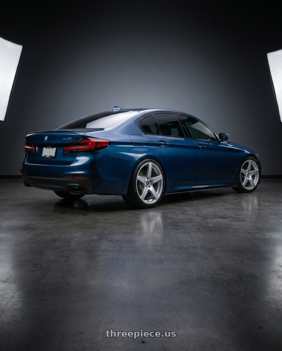 2023 BMW 540i with Forgestar CF5 5x114.3 20x9 +35 Gloss Silver wheels rear three quarter view square tires