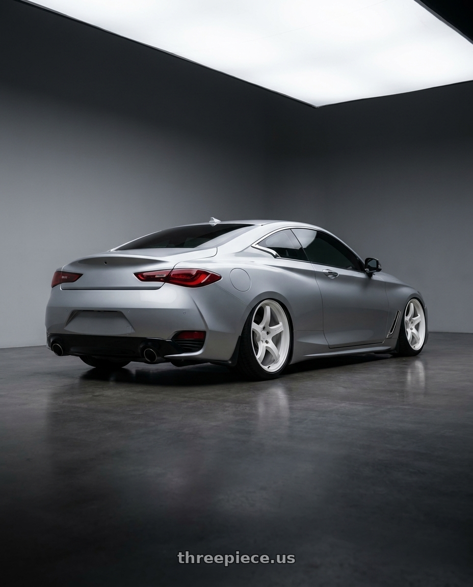 2020 Infiniti Q60 with Gram Lights 57CR 5x114.3 19x9.5+45 Ceramic Pearl wheels rear three quarter view slight stretch tires
