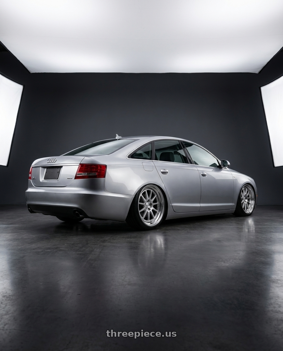 2010 Audi a6 with Work Seeker Fx 4x100 16x6.5+30 A Disk Matte Silver Polish wheels rear three quarter view slight stretch tires