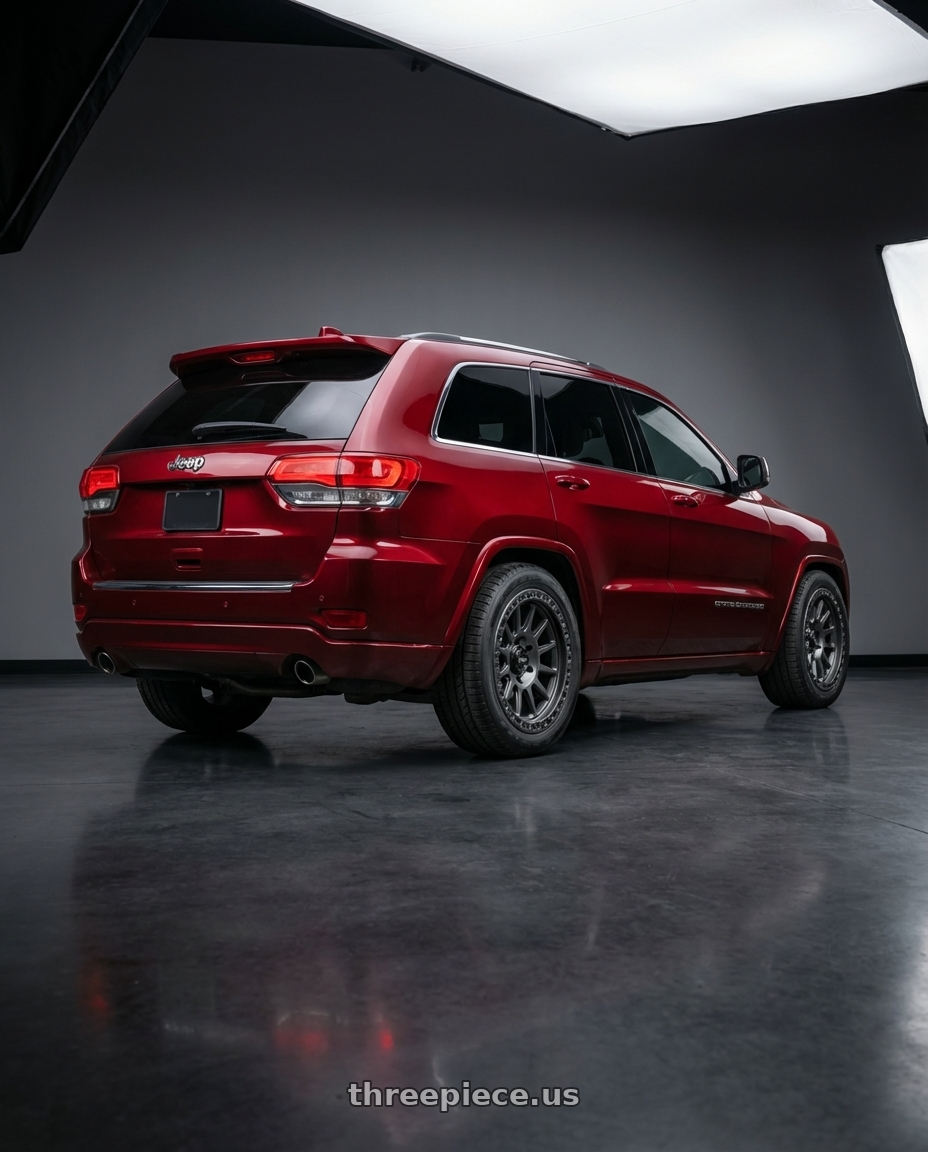 2017 jeep grand cherokee with MVX OFFROAD VX12 5X150 18x9 +18 Matte Graphite wheels rear three quarter view square tires