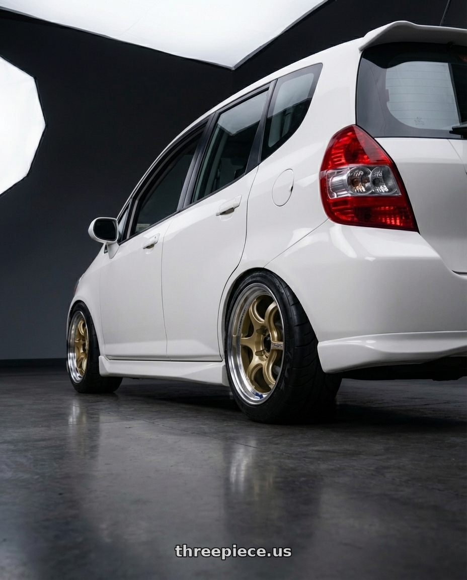 2007 Honda fit with Advan Racing RG-D2 4x100 15x8.0 +35 MACHINING & CHAMPAGNE GOLD wheels rear three quarter view meaty tires