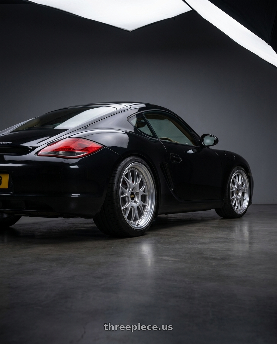 2009 Porsche Cayman with BBS LM-R 5x114.3 19x8.5+43 Diamond Silver wheels rear three quarter view square tires