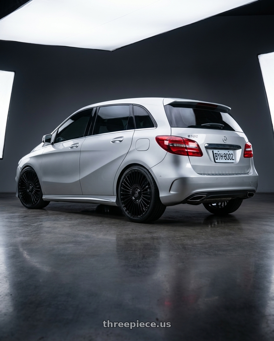 2015 Benz B180 with DOLCE LUXURY TRENTO 6x135/6x139.7 24x10 +35 Glossy Black wheels rear three quarter view square tires