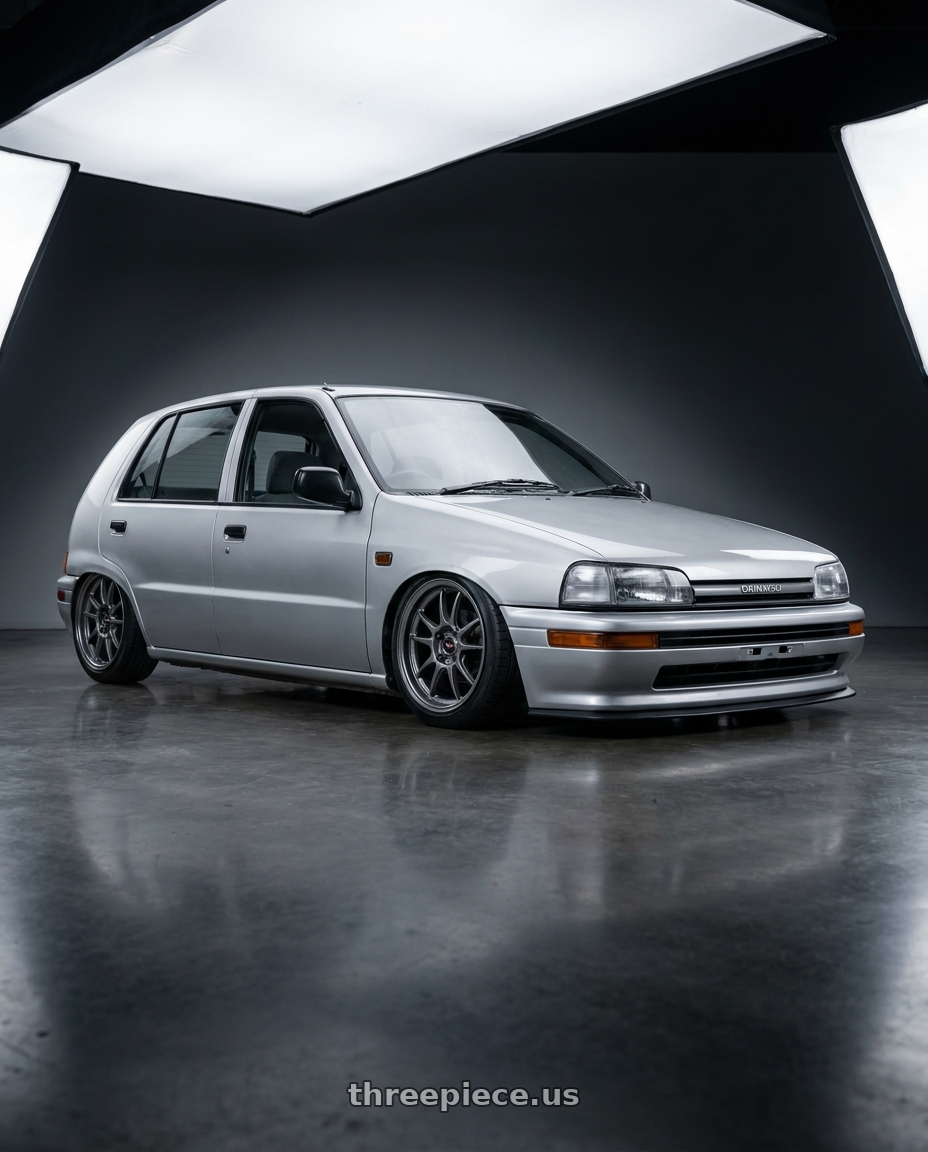 1995 Daihatsu charade 4door g200 with Vision Street-Designs 18 Hellion 4x114.3 15x6.5+38 Gunmetal wheels