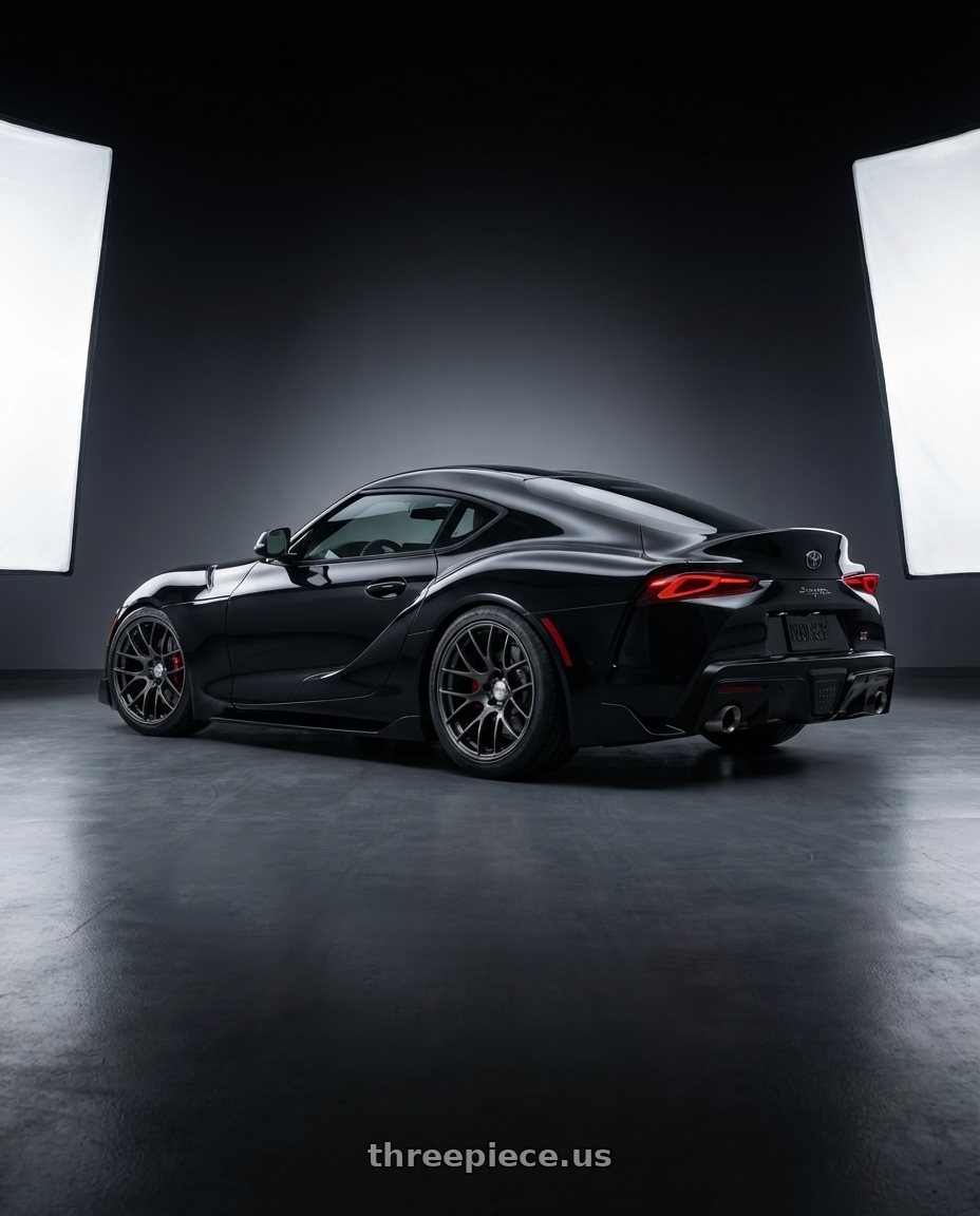 2026 toyota Supra final edition nocturnal black  with Work Emotion m8r 5x100 19x9.5 +38 Glim Black wheels rear three quarter view meaty tires