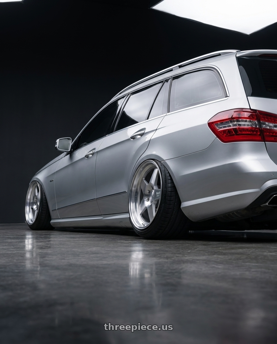 2010 Benz s212 with Klutch SL5 5x112 18x8.5  +35 Silver Machined wheels rear three quarter view extreme stretch tires