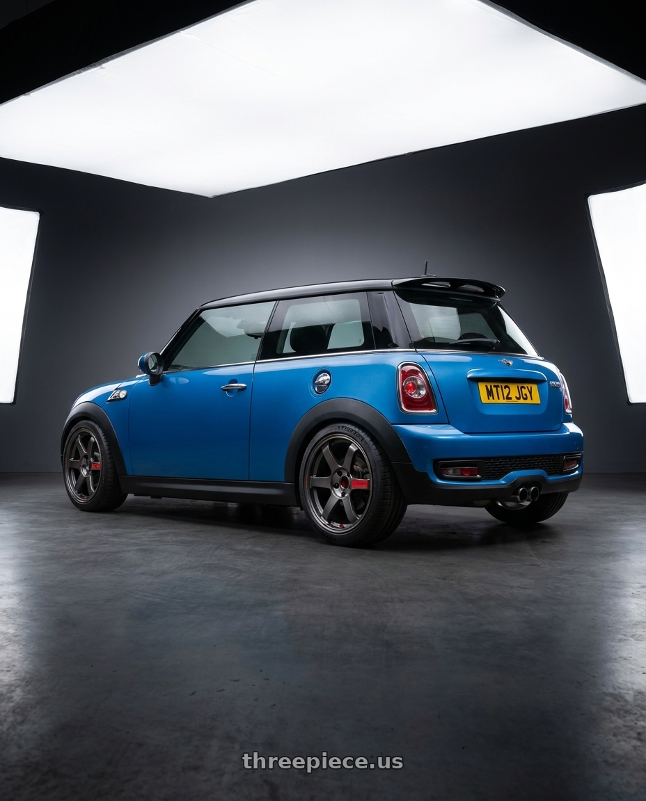 2012 mini cooper with Volk Racing TE37 Saga SL 5x114.3 18x8.5+45 Pressed Graphite wheels rear three quarter view square tires