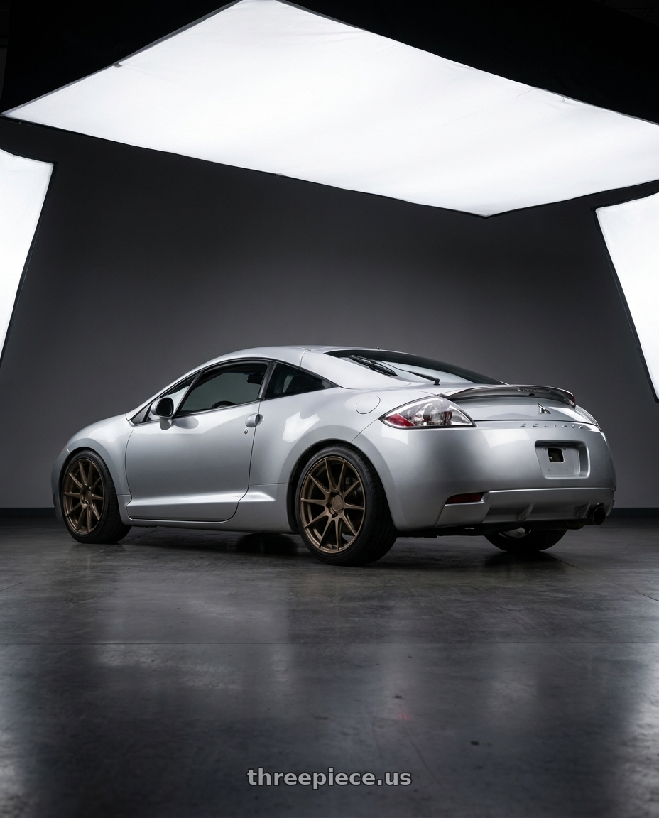2010 Mitsubishi Eclipse with Aodhan AH09 5x114.3 18x8.5 +35 Matte Bronze wheels rear three quarter view square tires