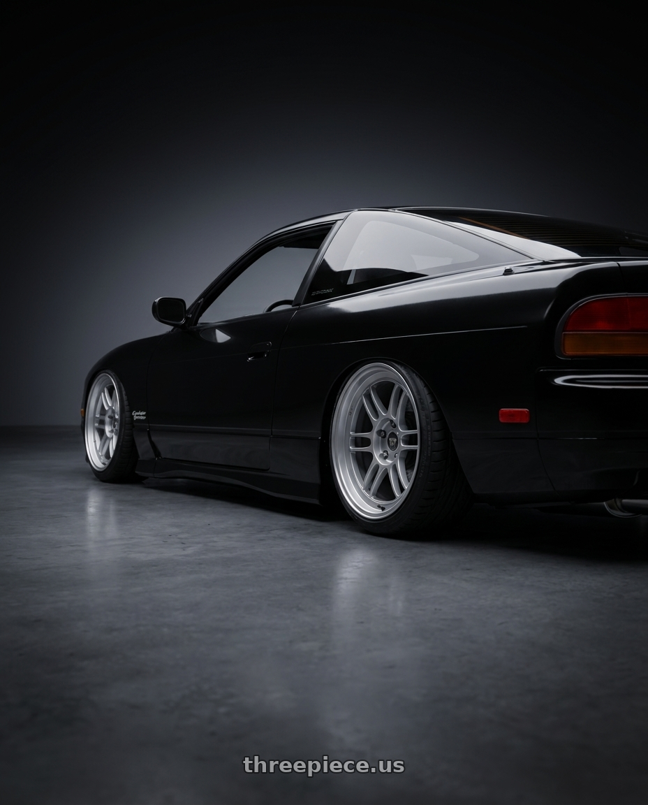 black 1992 240sx with Motegi MR207 MR7 5X100/5X114.3 14X6 +35 BRIGHT SILVER WITH CLEARCOAT wheels rear three quarter view slight stretch tires