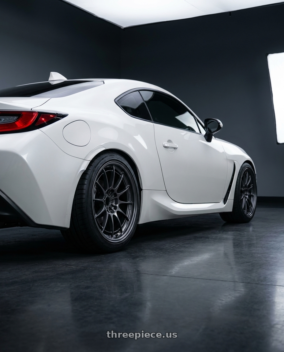 2022 Toyota GR86 with Enkei NT03+M 5x100 18x9.5+40 Gunmetal wheels rear three quarter view square tires