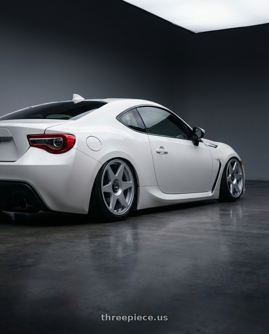 2016 Scion FR-S with fifteen52 TARMAC EVO 5x100 / 5x114.3 18x8.5 +35 SPEED SILVER (GLOSS SILVER) wheels rear three quarter view slight stretch tires