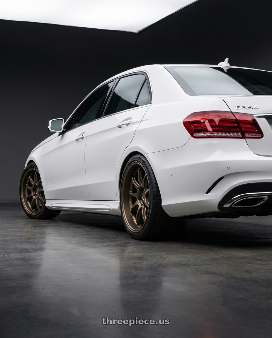 2016 Mercedes Benz e350 with Work Emotion D9r 5x112 19x9.5 +38 Matte Bronze wheels rear three quarter view square tires