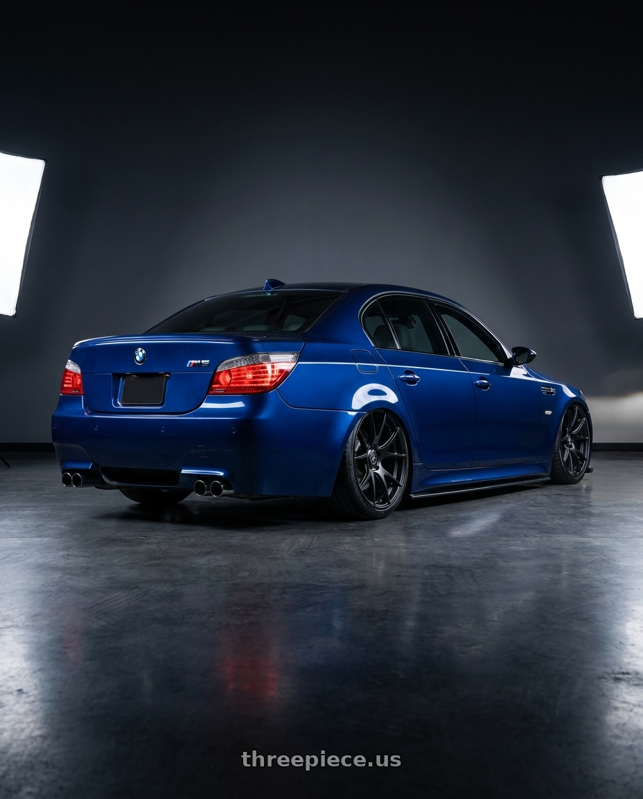 2010 BMW M5 E60 with Forgestar CF5V 5x120 20x12 +52 Satin Black wheels rear three quarter view slight stretch tires