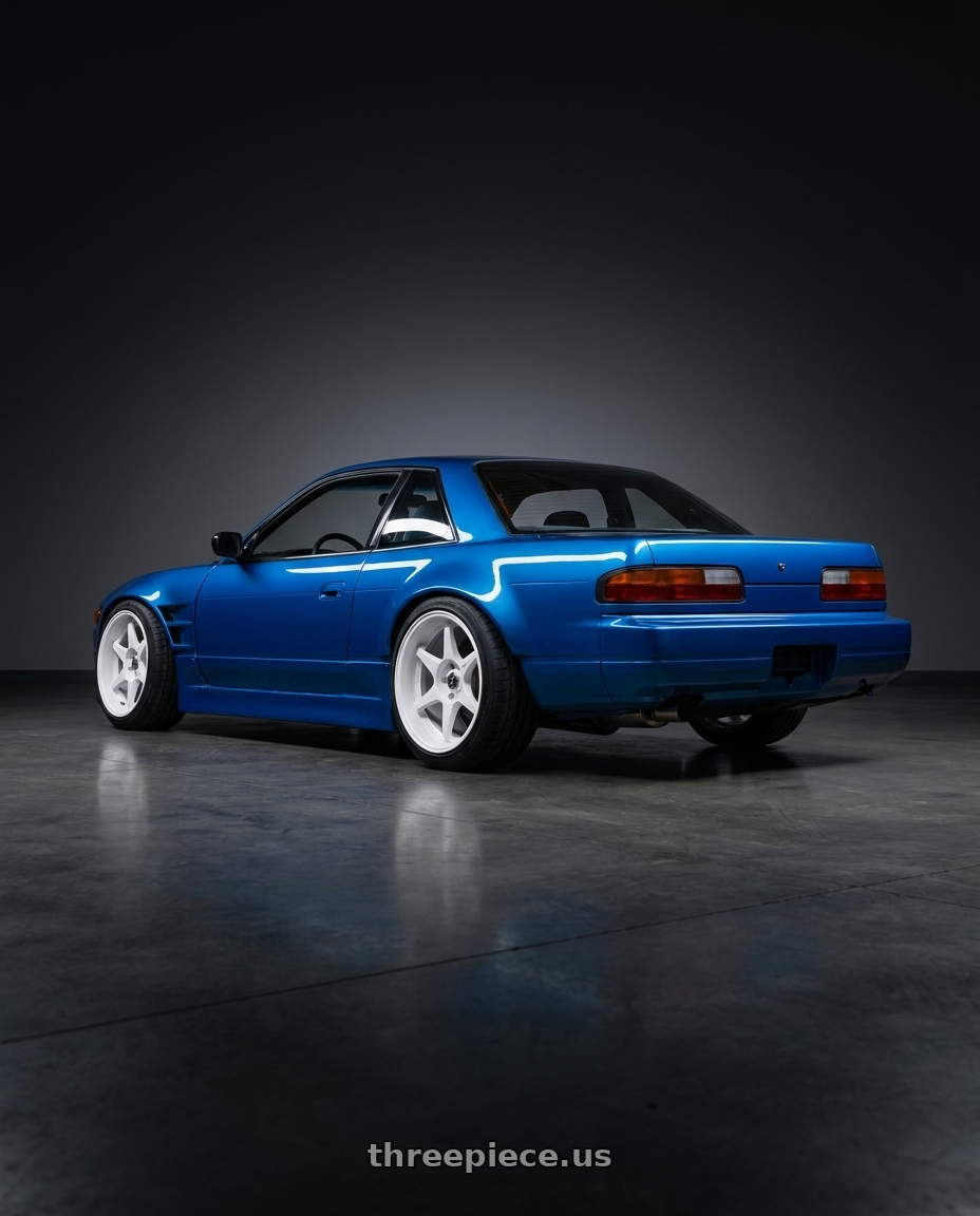 1993 Nissan 240sx coupe 75mm over fenders jet stream blue with Stage Wheels Knight 5x114.3 17x9 +10 White wheels rear three quarter view square tires