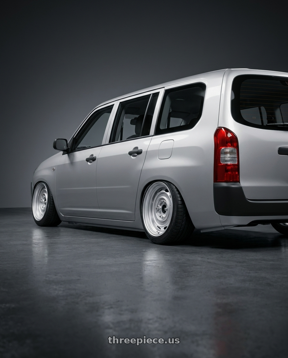 2026 toyota probox with Mobelwagen MW430S Interceptor 4X130 15x5.5 20 Silver wheels rear three quarter view slight stretch tires