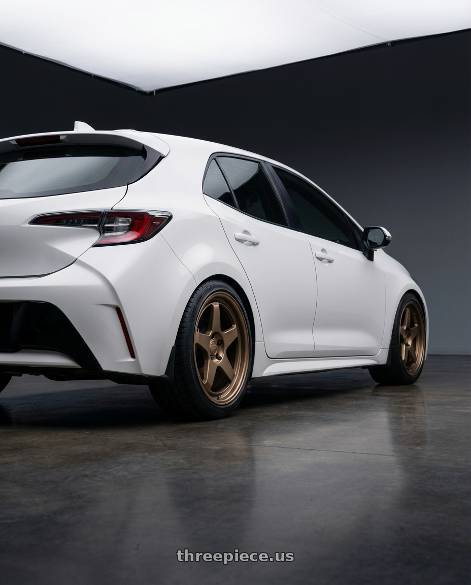 2023 Toyota Corolla Hatchback with Kansei K12B KNP 5x114.3 18x9 12 Bronze wheels rear three quarter view square tires