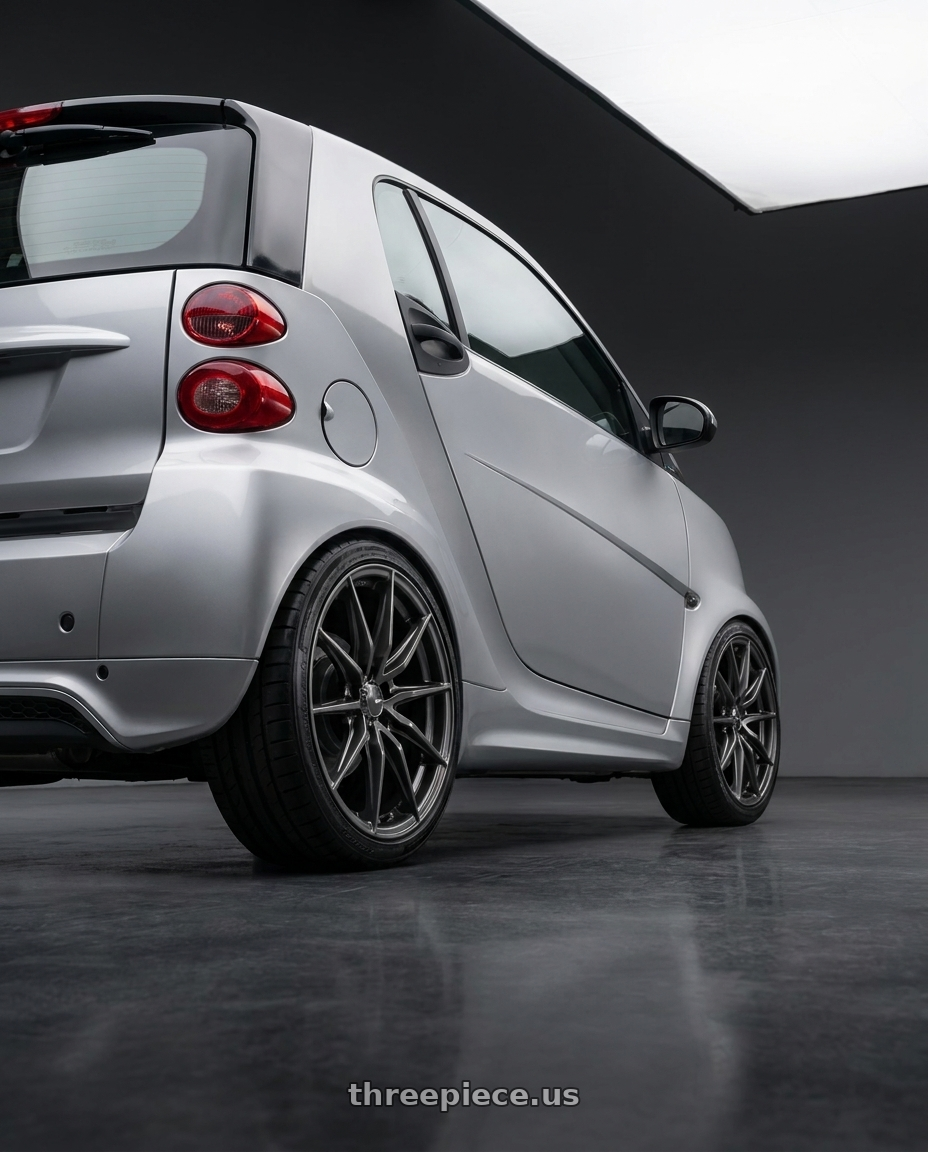 2009 Smart For Two with Enkei DRACO 5x120 18x8.0+35 Anthracite wheels rear three quarter view square tires
