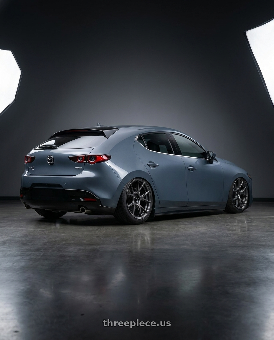 2023 Mazda Mazda3 Turbo with Konig Ampliform 5x114.3 18x10+20 Dark Metallic Graphite wheels rear three quarter view slight stretch tires
