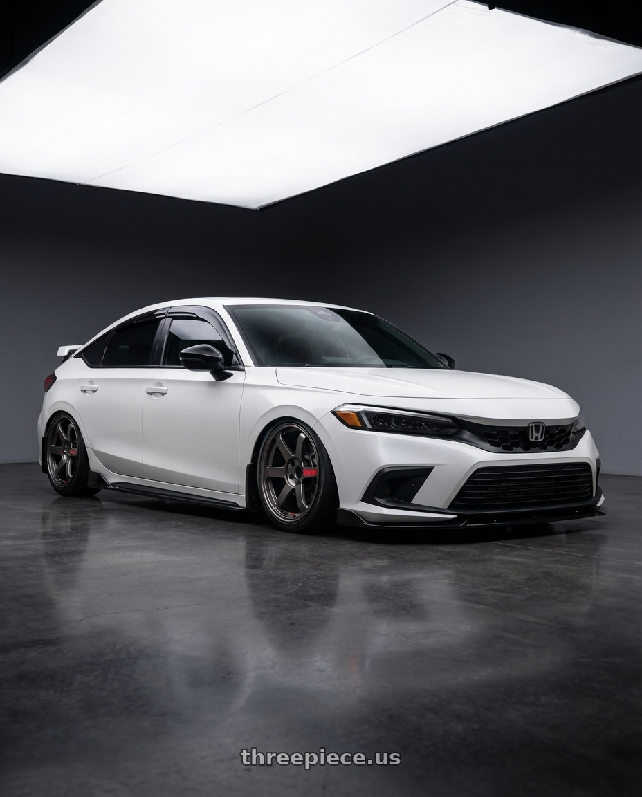 2024 Honda Civic Hatchback Sports Touring with Volk Racing TE37 Saga SL 5x114.3 18x9.5+35 Pressed Graphite wheels front three quarter view stanced stance