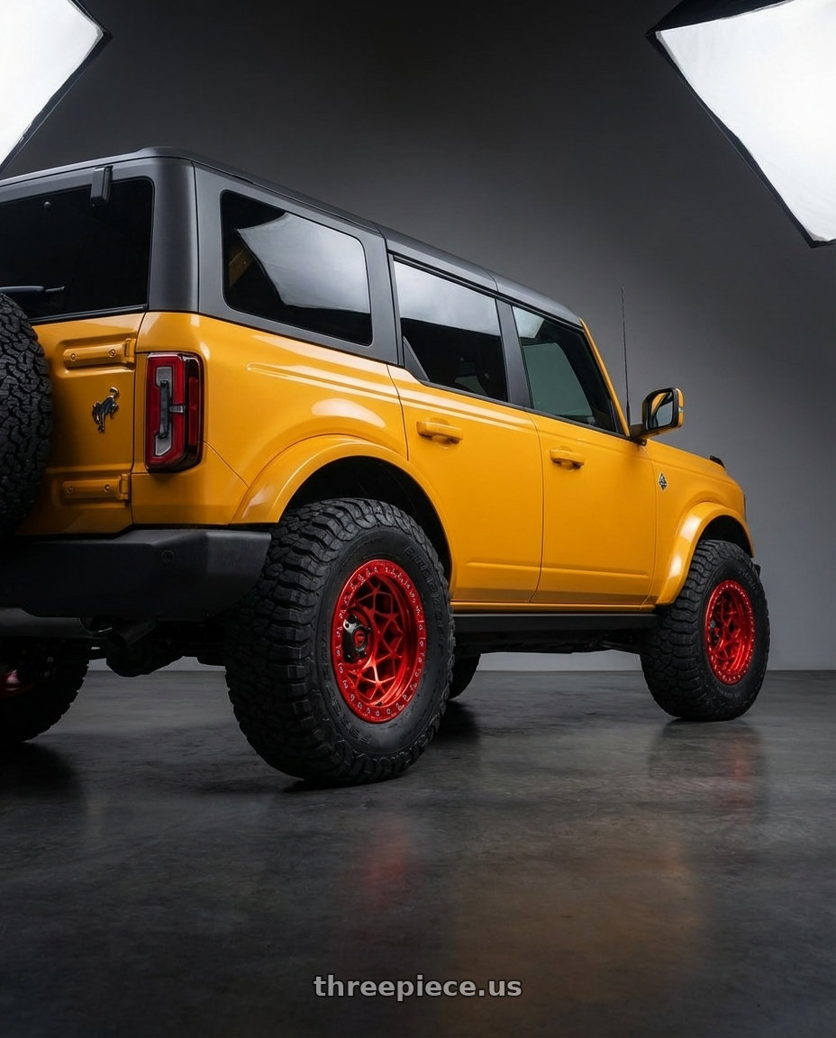 2024 Ford Bronco with Fuel 1PC D121 UNIT BEADLOCK 6X139.7 17X9 -15 CANDY RED wheels rear three quarter view meaty tires