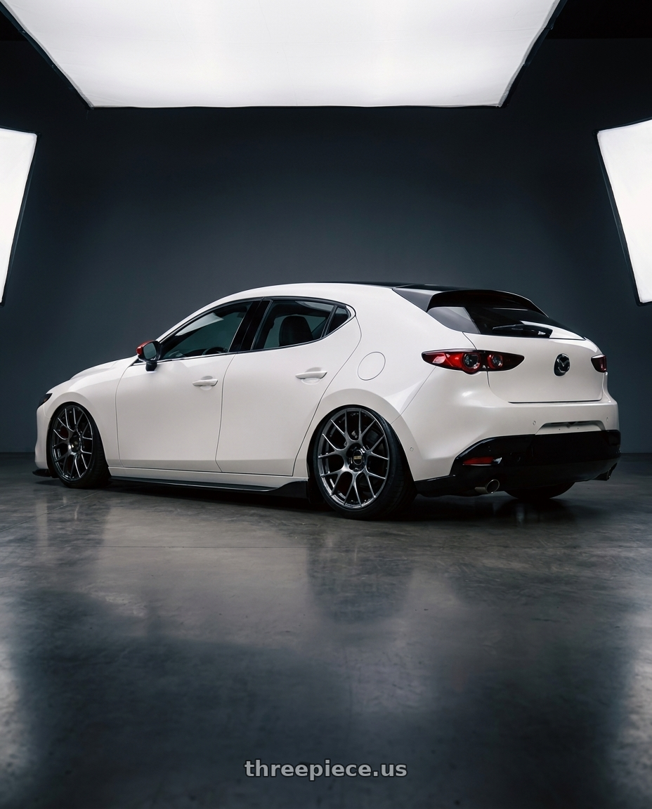 2024 Mazda3 Fastback  with BBS RE-V7 5x112 19x9.5 +36 Diamond Black wheels rear three quarter view slight stretch tires