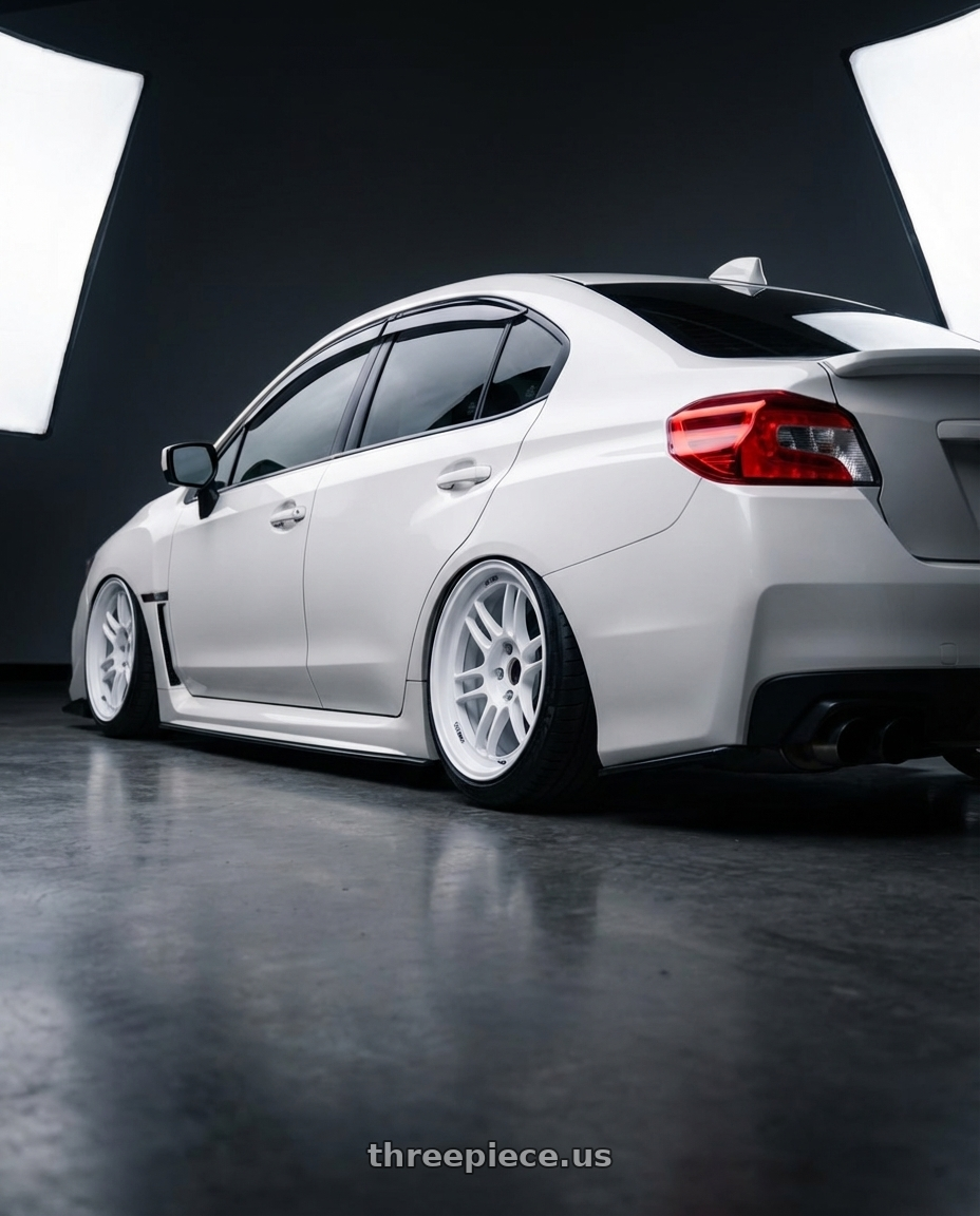2015 Subaru wrx  with Enkei RPF1 5x114.3 18x9.5+38 Vanquish White wheels rear three quarter view extreme stretch tires