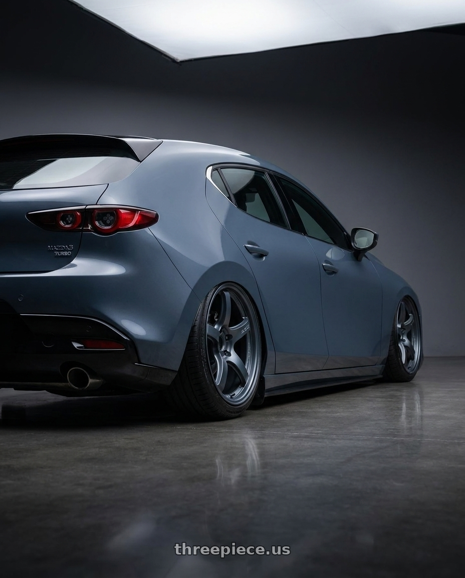2023 Mazda Mazda3 Turbo with Gram Lights 57CR 5x114.3 18x9.5+22 Gunblue II wheels rear three quarter view slight stretch tires