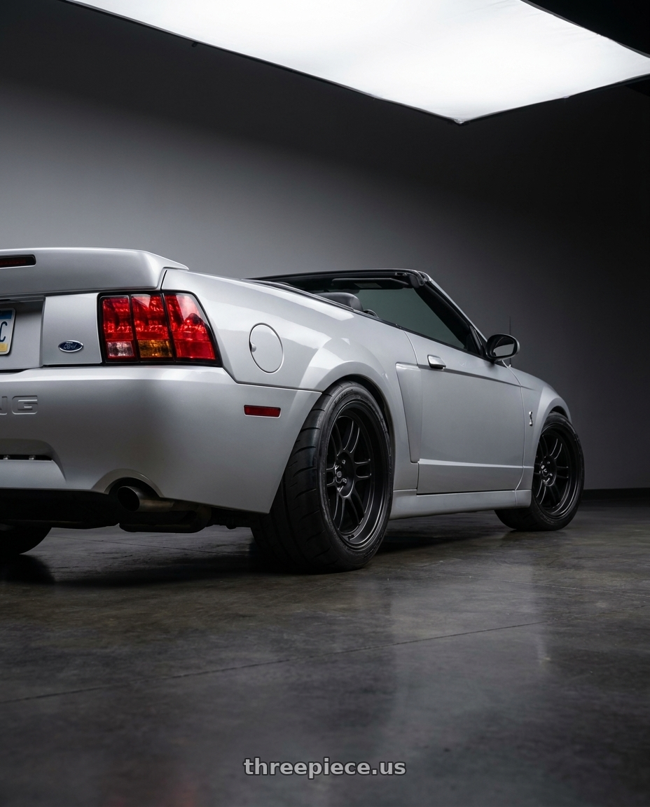 2004 ford mustang  with MST Wheels Suzuka 5X114.3 18x9.5 +25 Matte Black wheels rear three quarter view meaty tires
