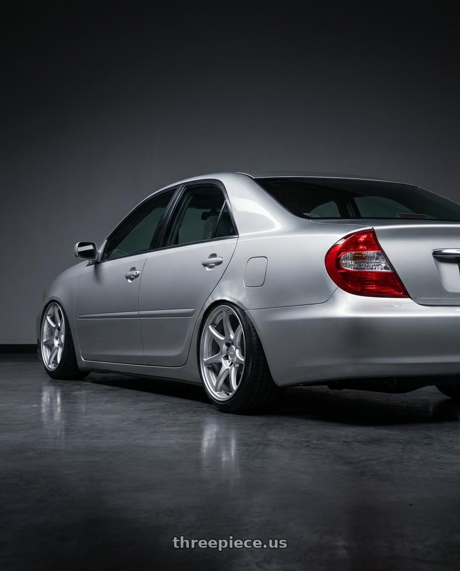 2002 Toyota camry with Kansei K11S Tandem 5x114.3 17x9 35 Hyper Silver wheels rear three quarter view slight stretch tires