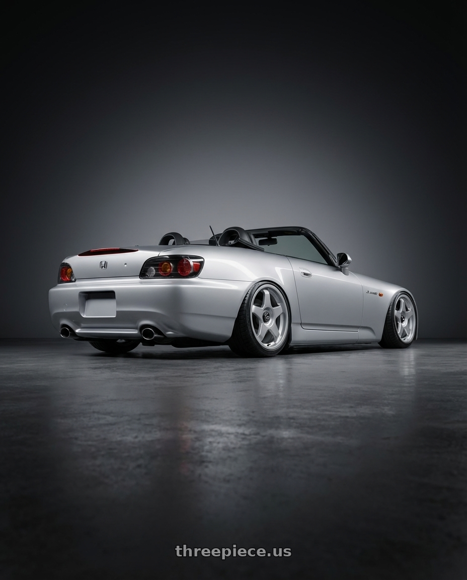 2009 Honda S2000 with fifteen52 CHICANE 5x114.3 / 5x100 18x8.5 +35 SPEED SILVER (GLOSS SILVER) wheels rear three quarter view slight stretch tires