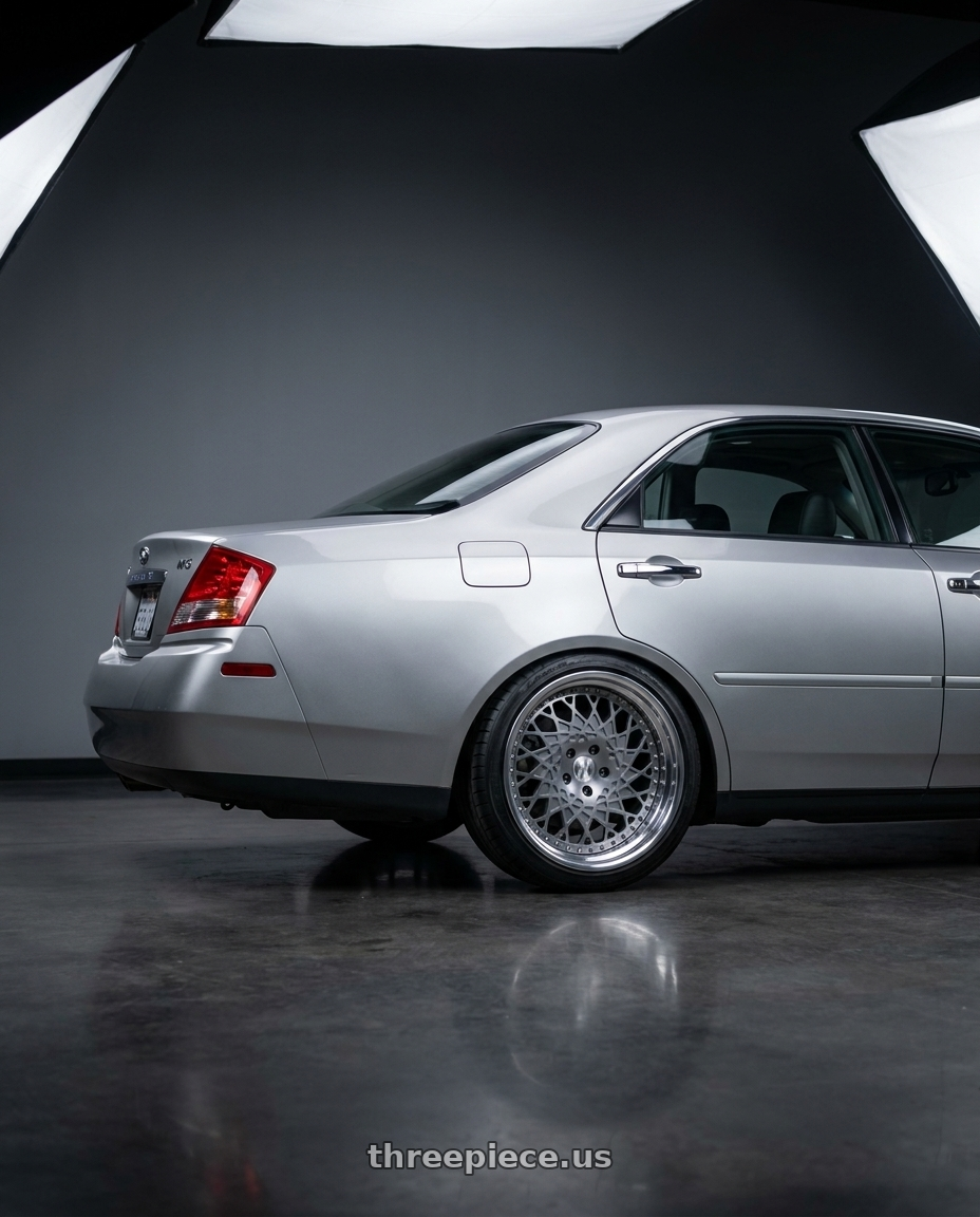 2004 Infiniti M45 with Heritage Wheel FUJI-DIR wheels rear three quarter view slight stretch tires