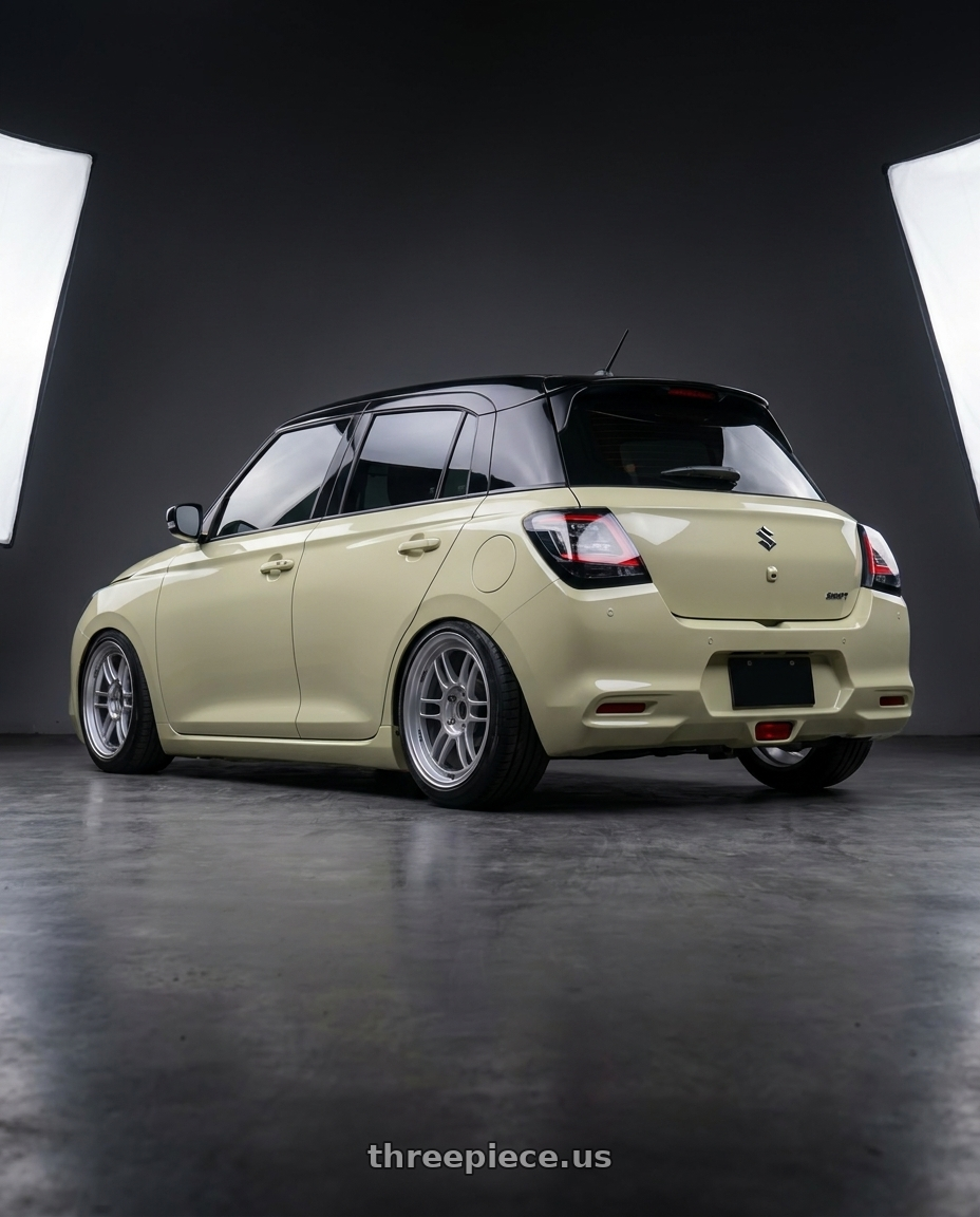 2026 Suzuki Swift with Enkei RPF1 4x100 16x7+35 Silver wheels rear three quarter view square tires