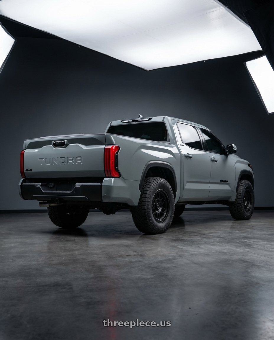 2024 Toyota Tundra with XD XD127 BULLY 6X139.7 20X9 +18 SATIN BLACK WITH REINFORCING RING wheels rear three quarter view meaty tires