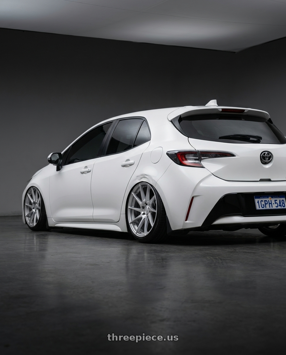 2023 Toyota Corolla Hatchback with Aodhan AH09 5x114.3 18x8.5 +35 Gloss Silver Machined Face wheels rear three quarter view slight stretch tires